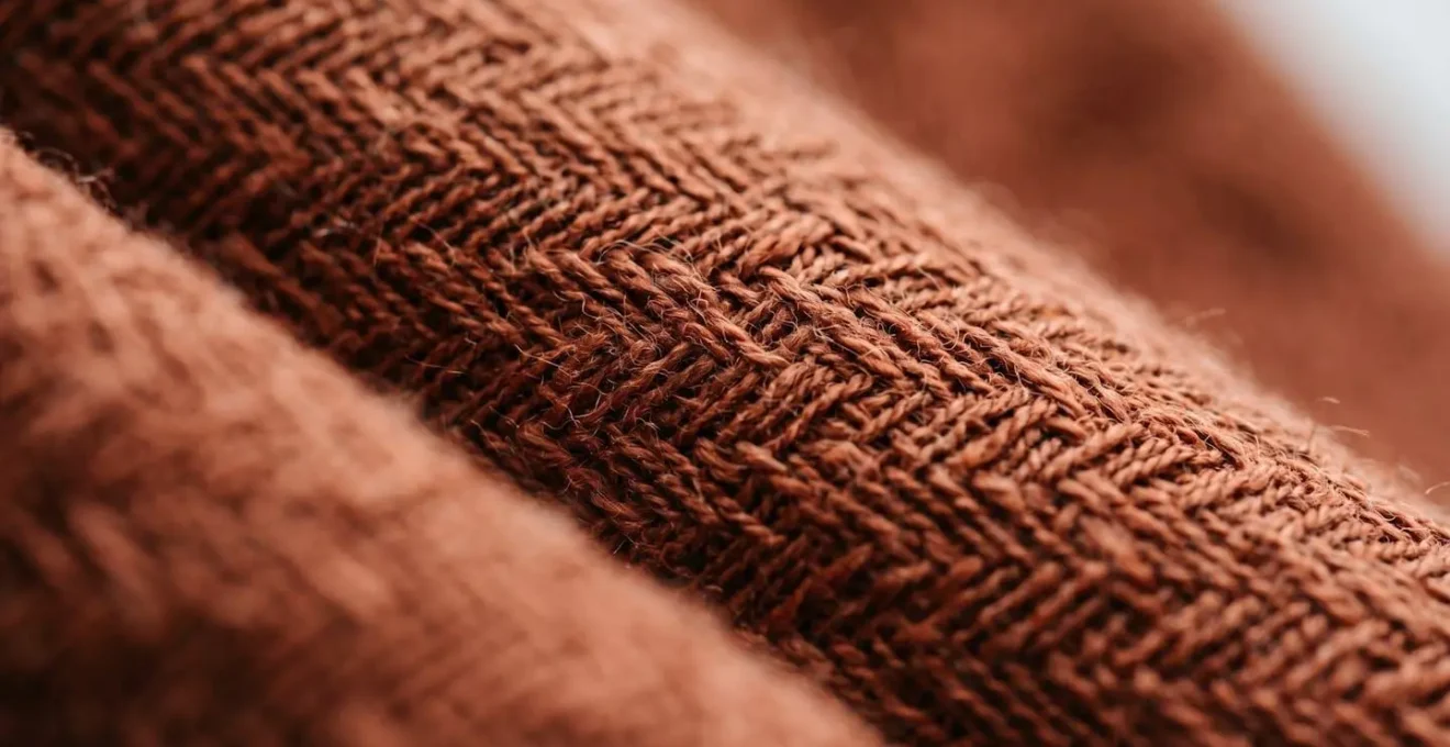 Extreme close-up macro shot revealing the intricate weave and texture of high-quality seasonal textile fabric