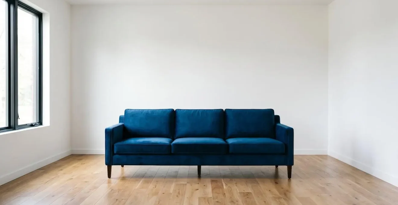 Symmetrical view of contemporary living room showing statement sofa with balanced negative space